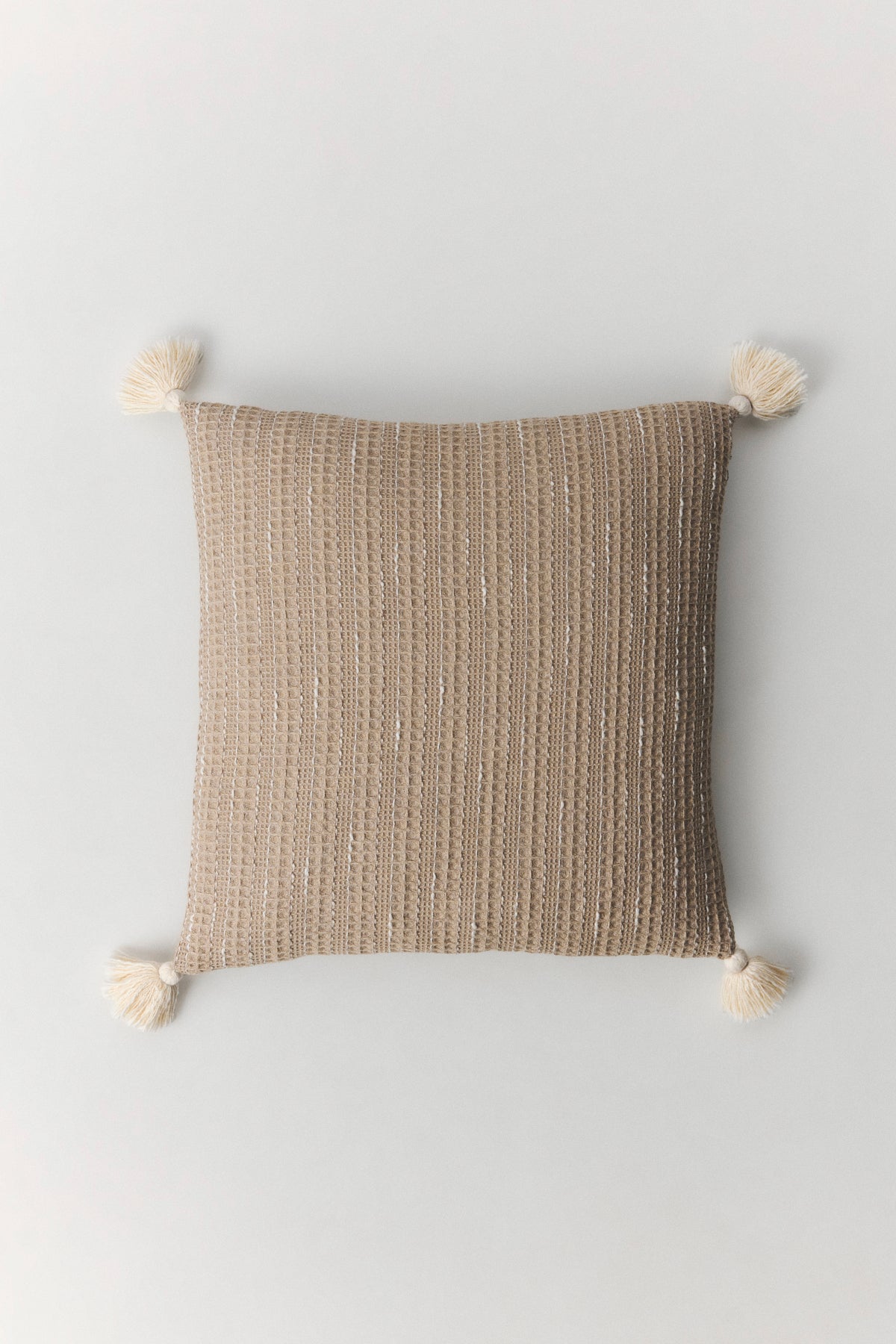 Fresco mélange cotton waffle cushion with pompom detail in beige