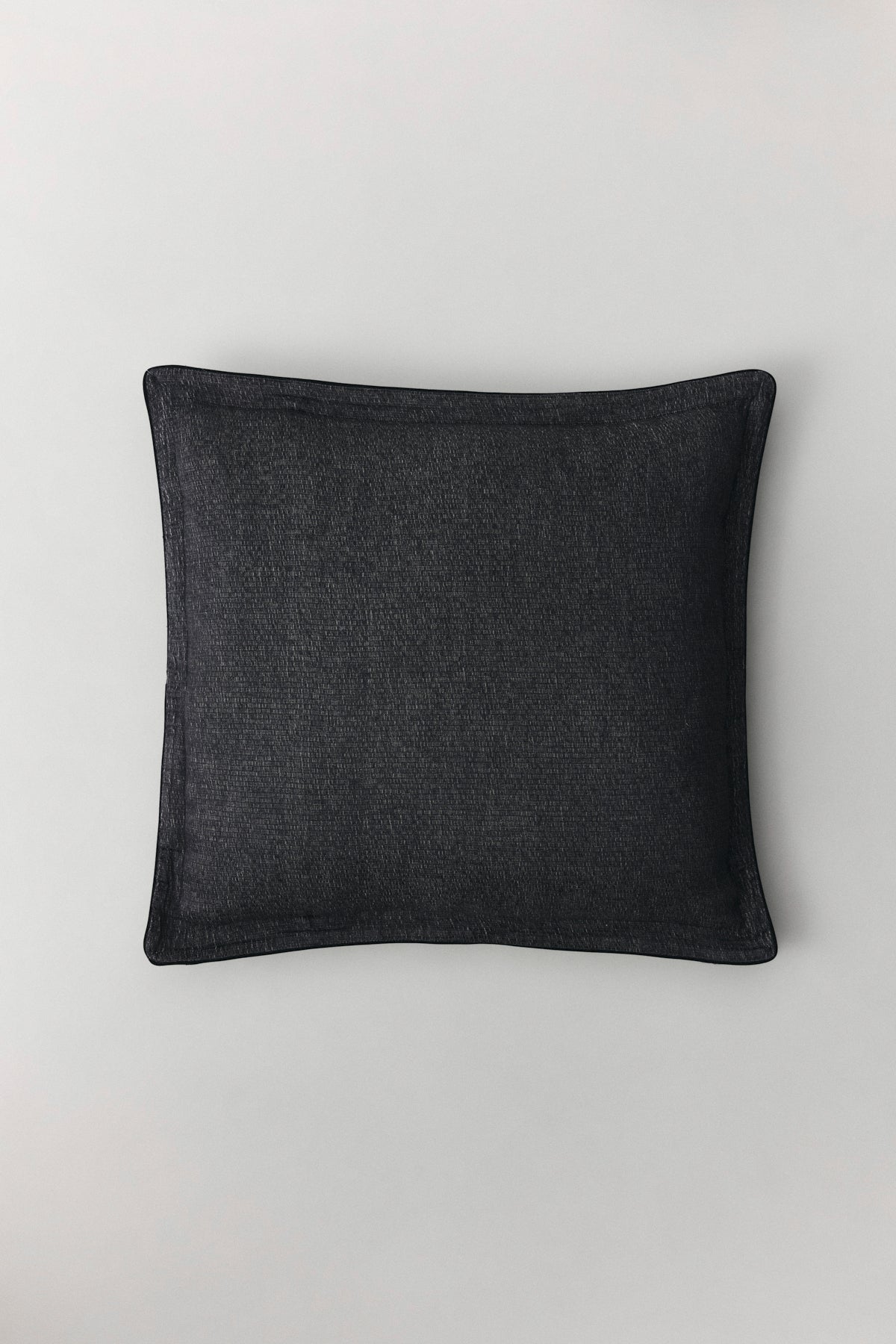 Kamelya cushion with piped edges in natural linen with subtle sheen