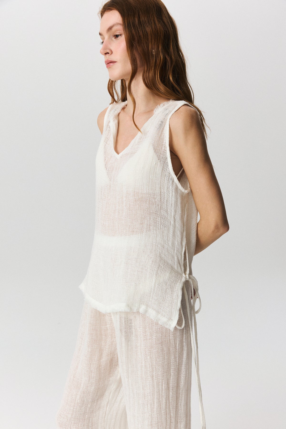 Savana cropped linen top with adjustable side ties and raw-edge hem