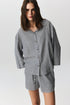 Nina shirt with fine stripes and coconut shell buttons, draped casually
