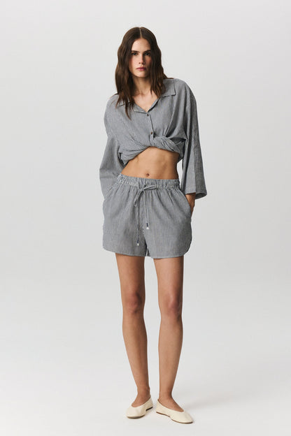 Nina striped linen cotton shorts with rounded hem on white background