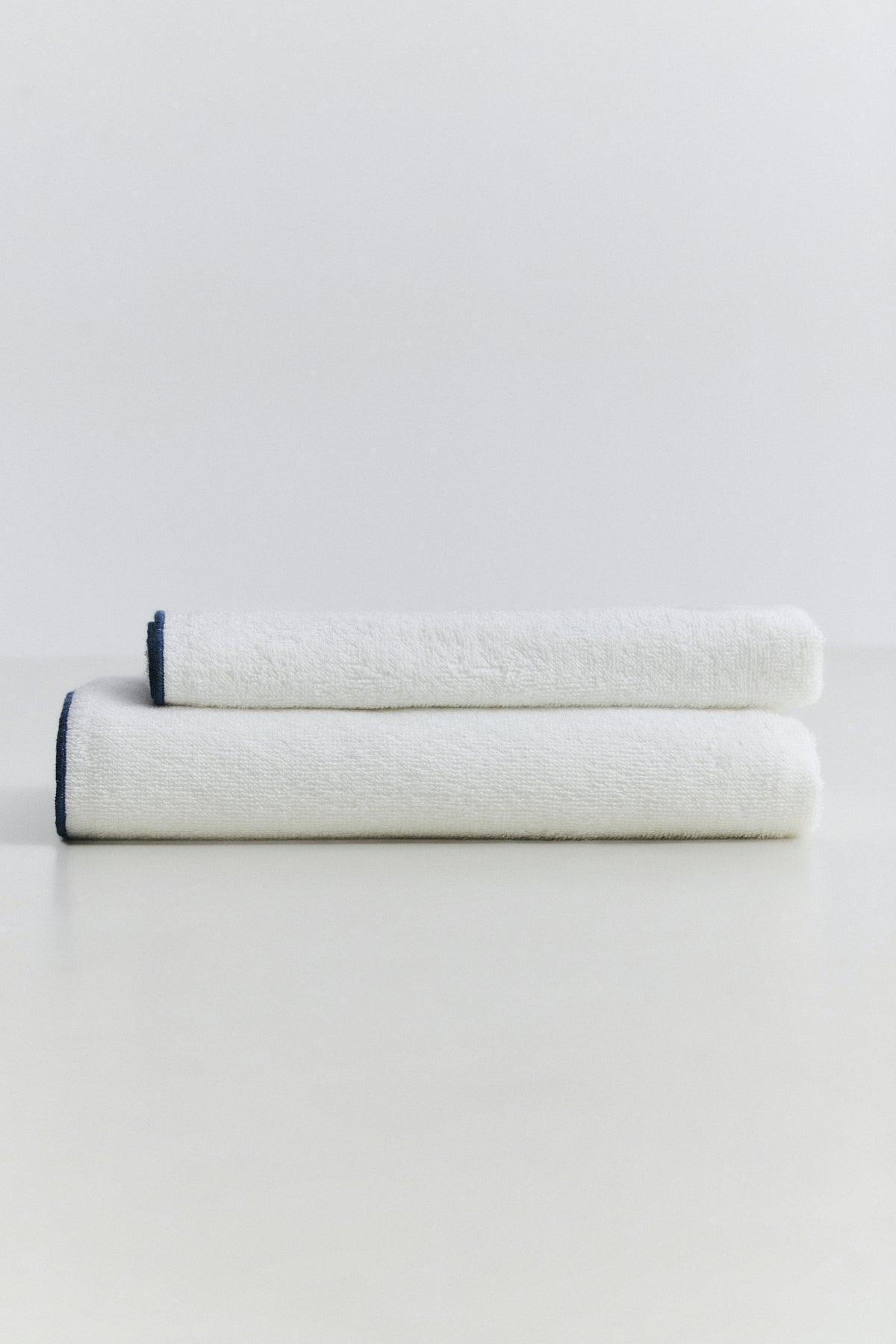 Ikigai lightweight cotton towel with contrast stitching detail
