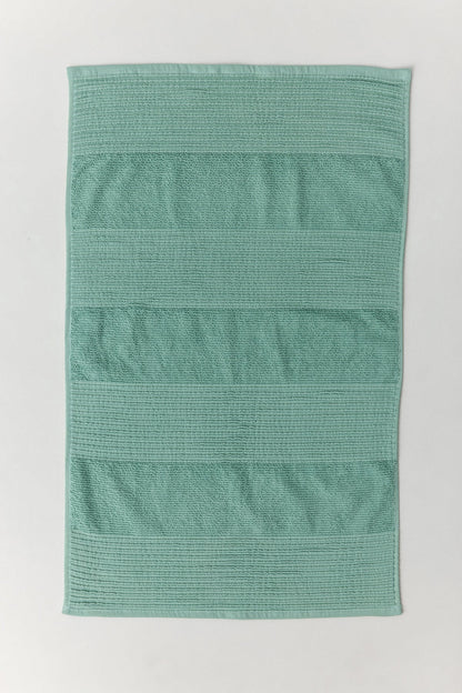 Sardes foot towel in mango yellow with self-striped cotton weave