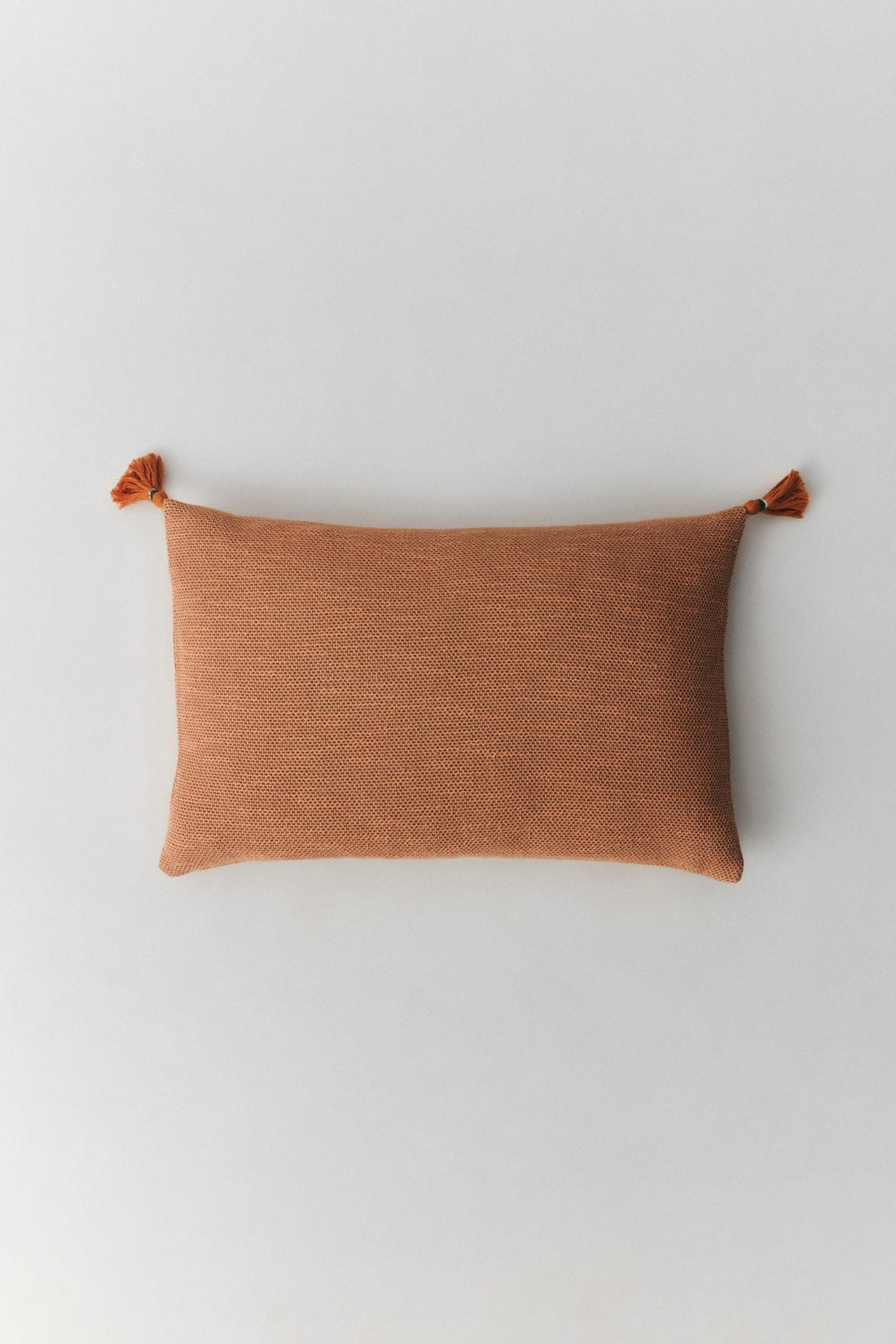 Capella textured cotton cushion cover with handmade pompoms in charcoal