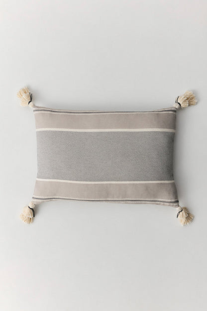 Brunella cotton cushion with handmade pompom details at corners