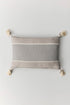 Brunella cotton cushion with handmade pompom details at corners