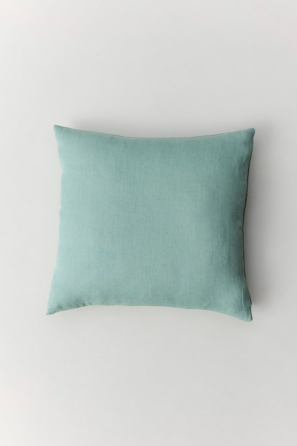Siena textured linen cushion in off-white with metal zipper and leather accent