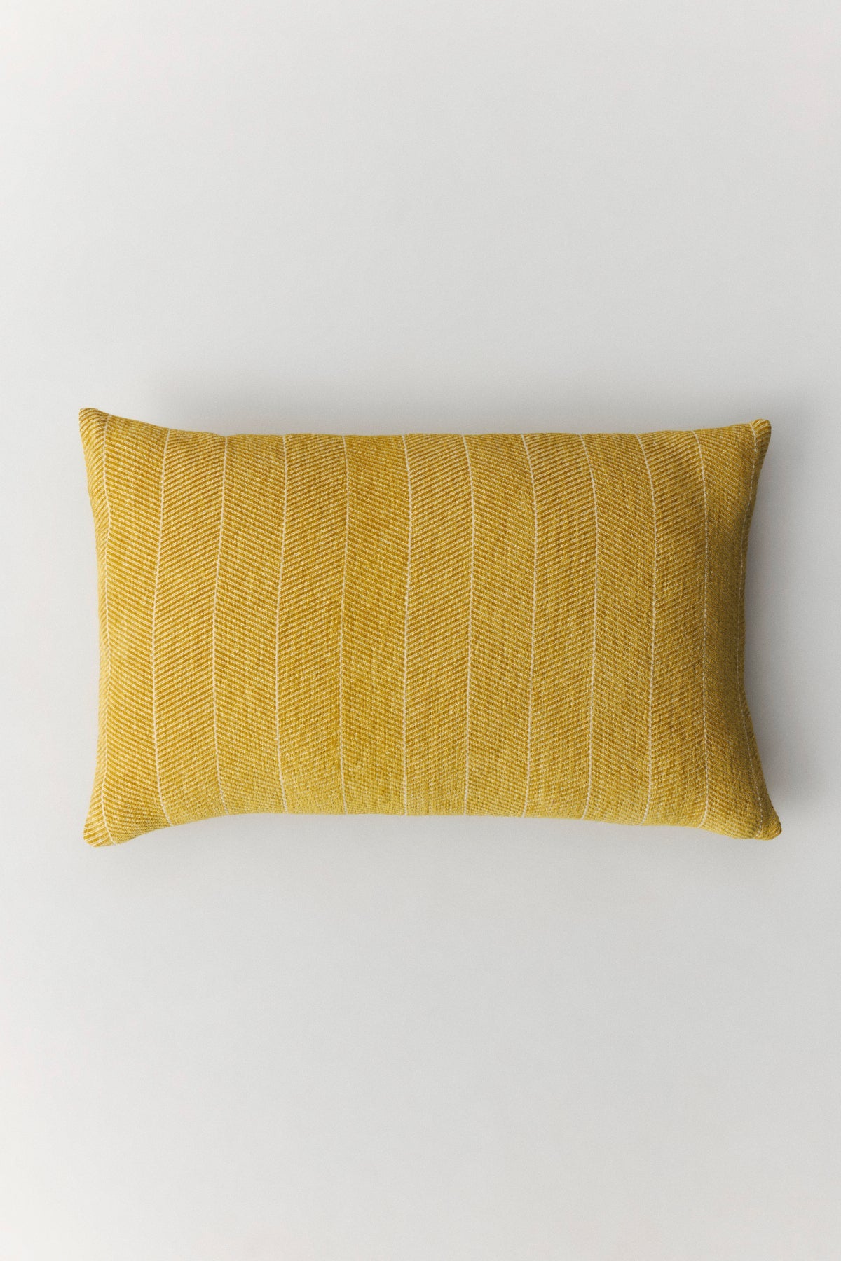Bone herringbone patterned cushion in sky blue with velvety cotton texture