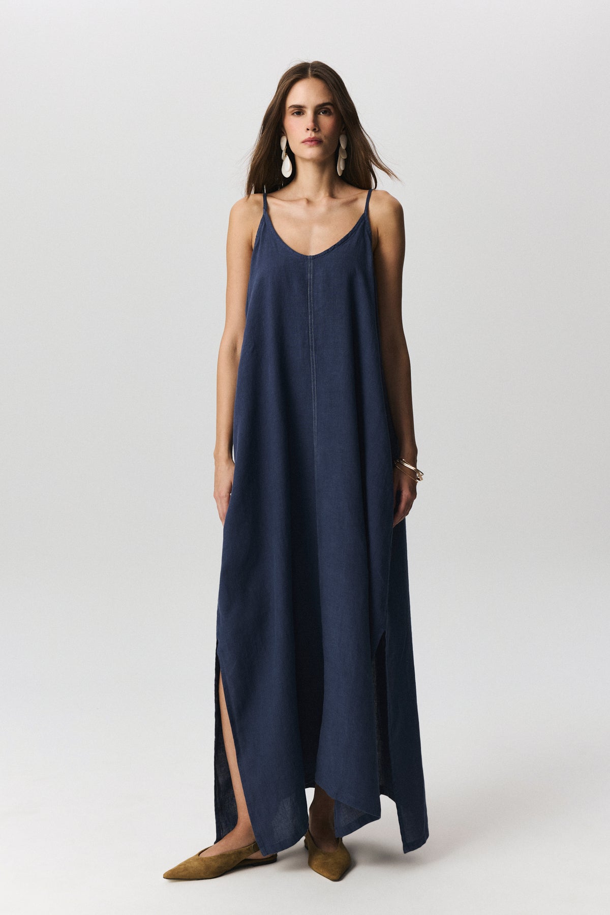 Amara linen dress with adjustable straps and flowing silhouette