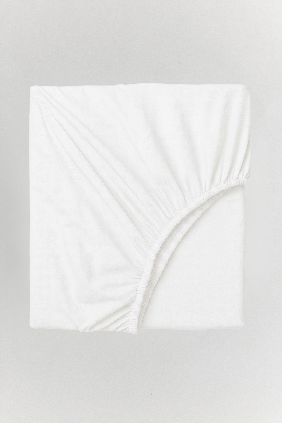 Crinkle fitted bed sheet in soft cotton with natural texture