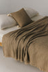 Fresco mélange cotton waffle bedspread in beige on a bed