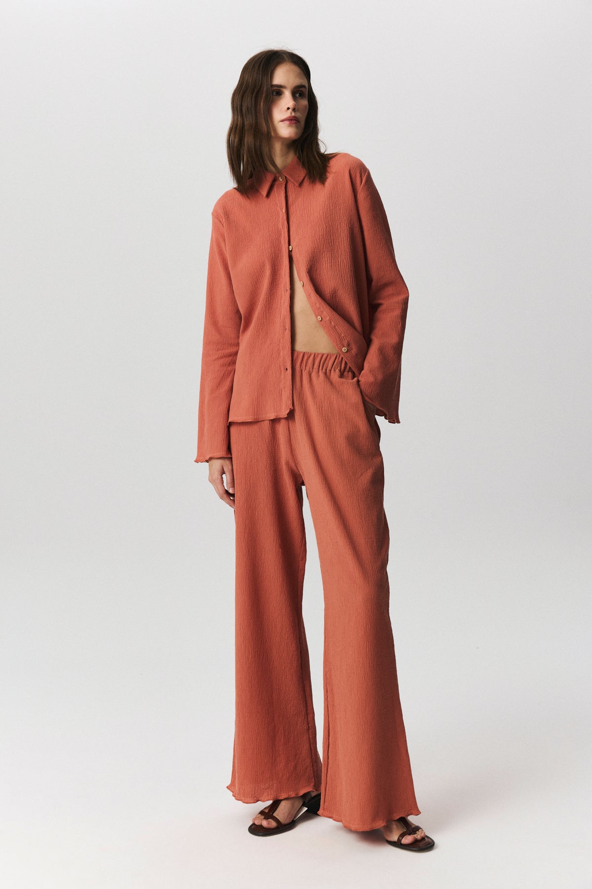 Navia crinkle cotton trousers with relaxed fit and refined hem details