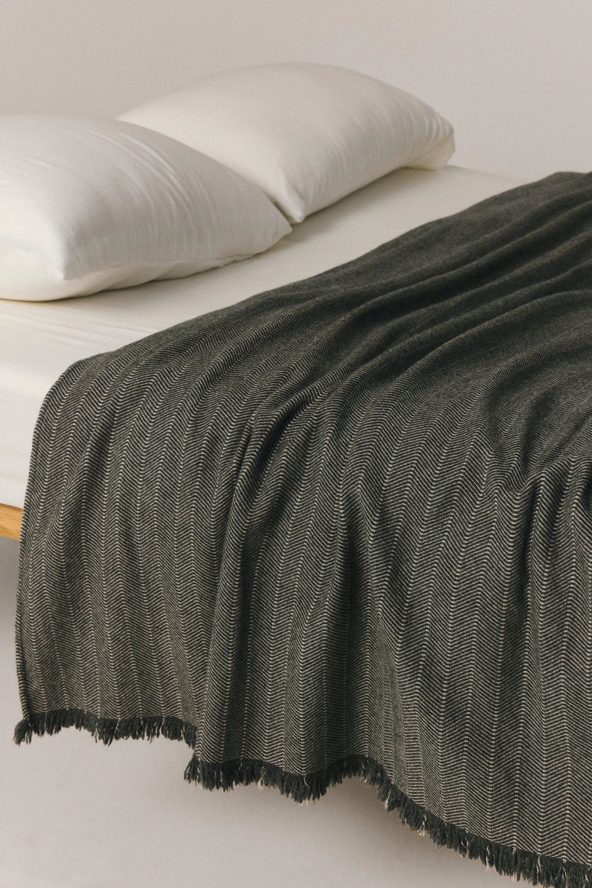 Odense beige wool blend throw with contrast stripe and fringed edges