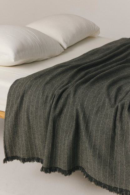 Odense beige wool blend throw with contrast stripe and fringed edges