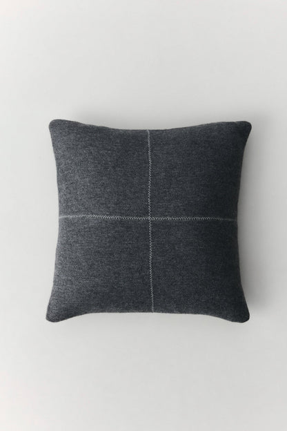 Talin wool cushion with natural texture and decorative zigzag stitching