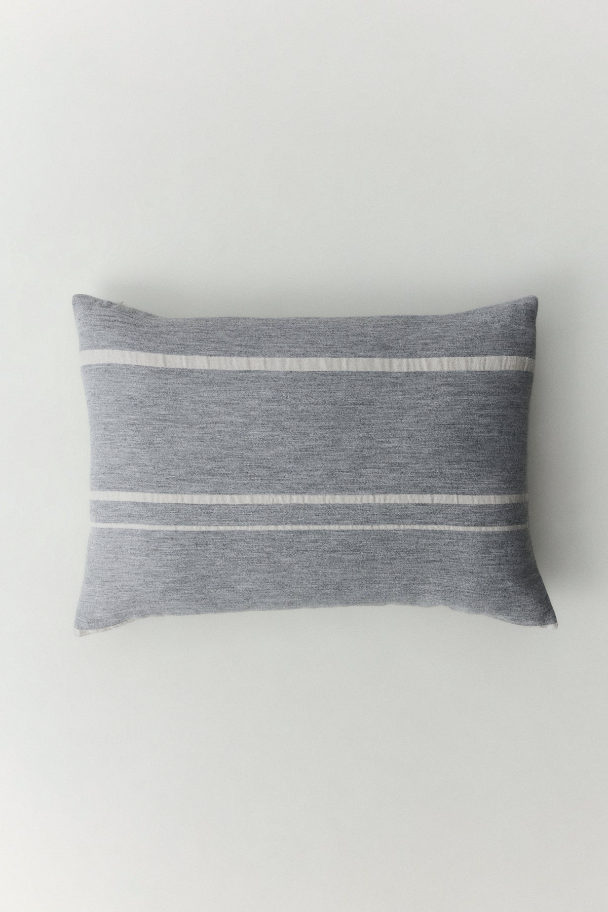 Valetta wool cushion cover with subtle linear detail and concealed zipper