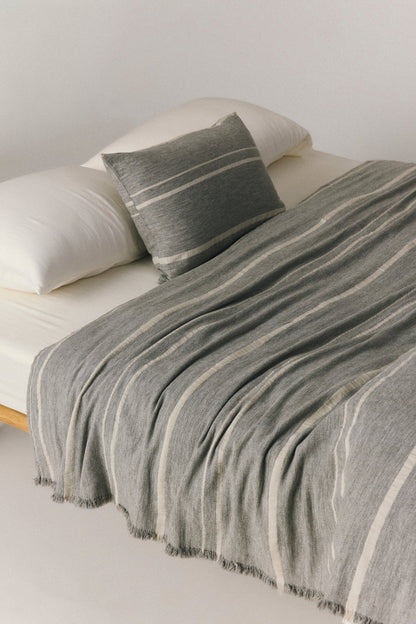 Valetta wool blend throw in grey with subtle stripe detail