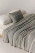 Valetta wool blend throw in grey with subtle stripe detail
